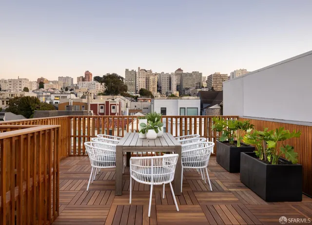 a view of a chairs on the roof deck