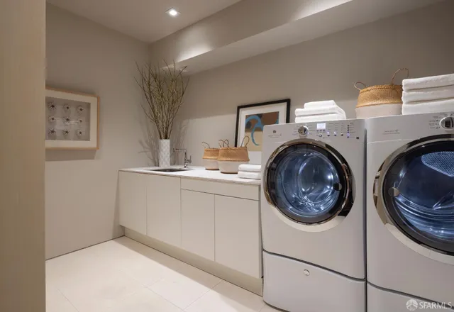 a spacious bedroom with a bed and large windows