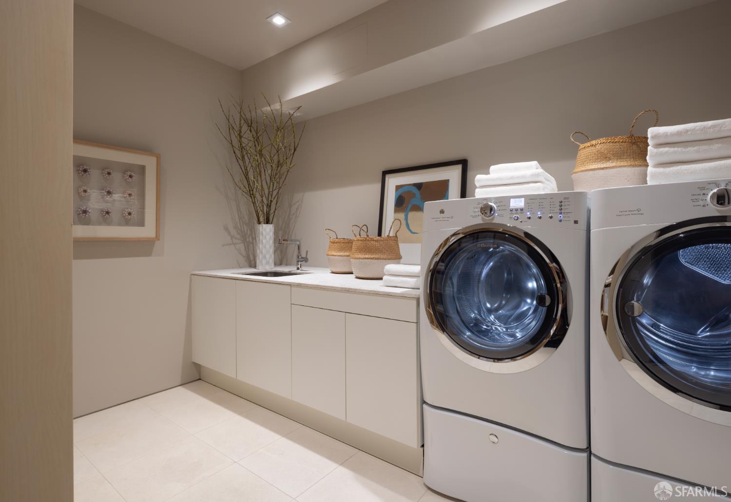 1864 Greenwich Street San Francisco, CA 94123 - Photo 24 of 27 a utility room with sink dryer and washer
