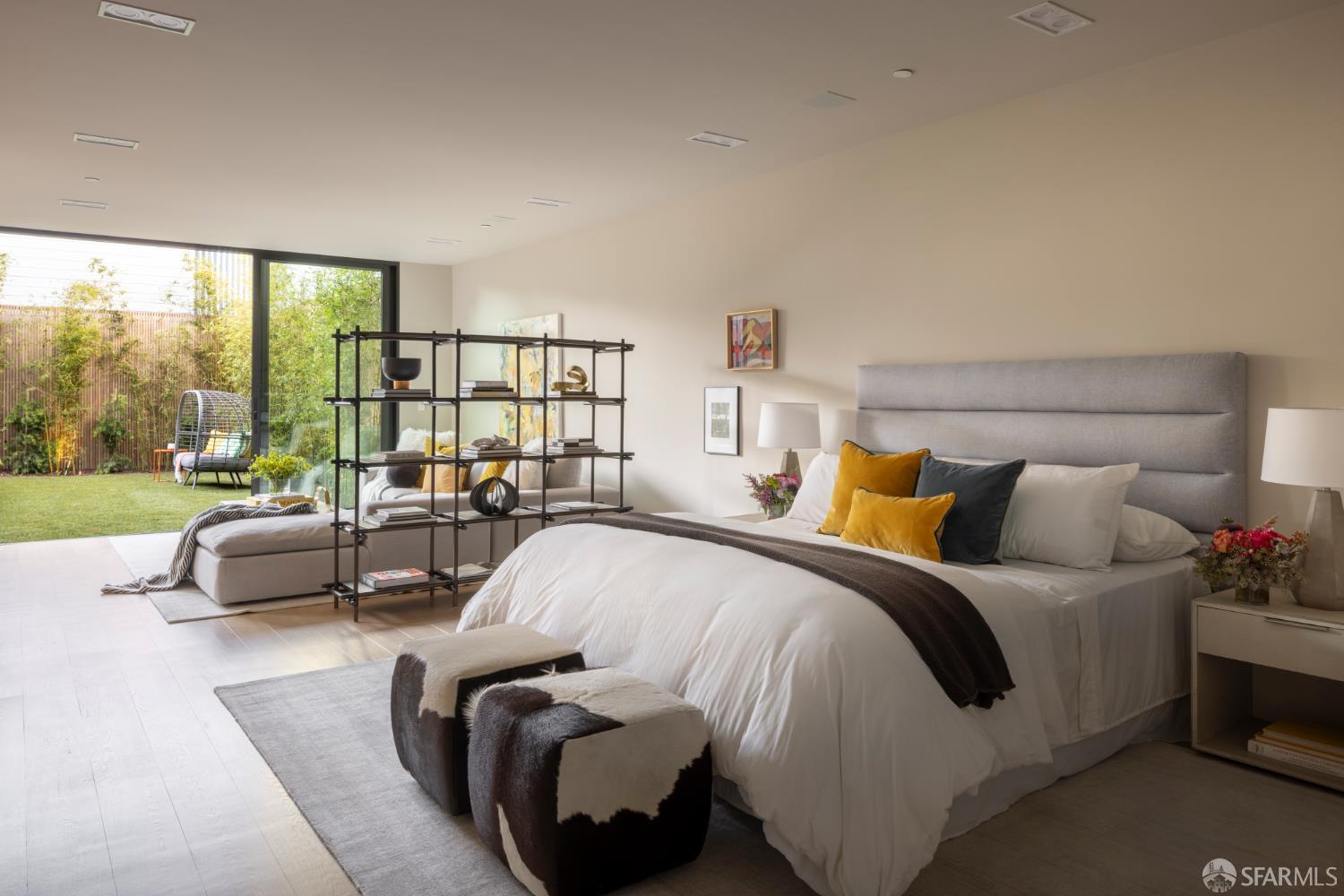 1864 Greenwich Street San Francisco, CA 94123 - Photo 25 of 27 a spacious bedroom with a bed and large windows