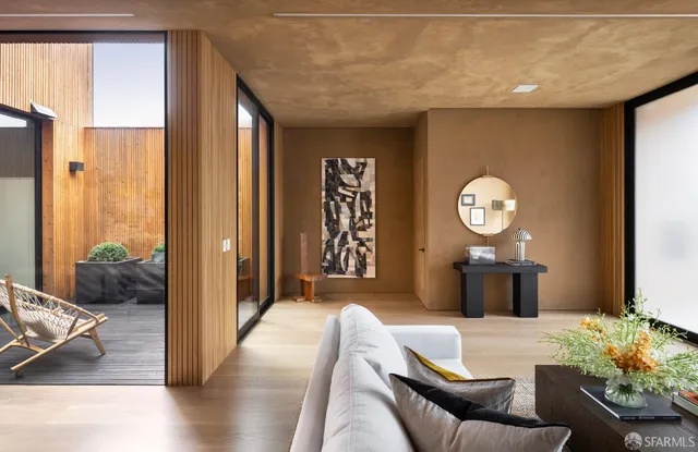 a bedroom with furniture and a large mirror