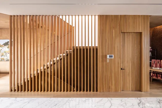 an entryway with a wooden door