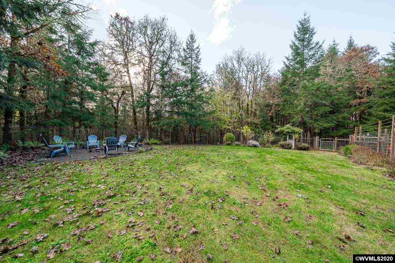 15241 Strong Road Dallas, OR 97338 - Photo 33 of 40 a view of a chair and tables in the garden
