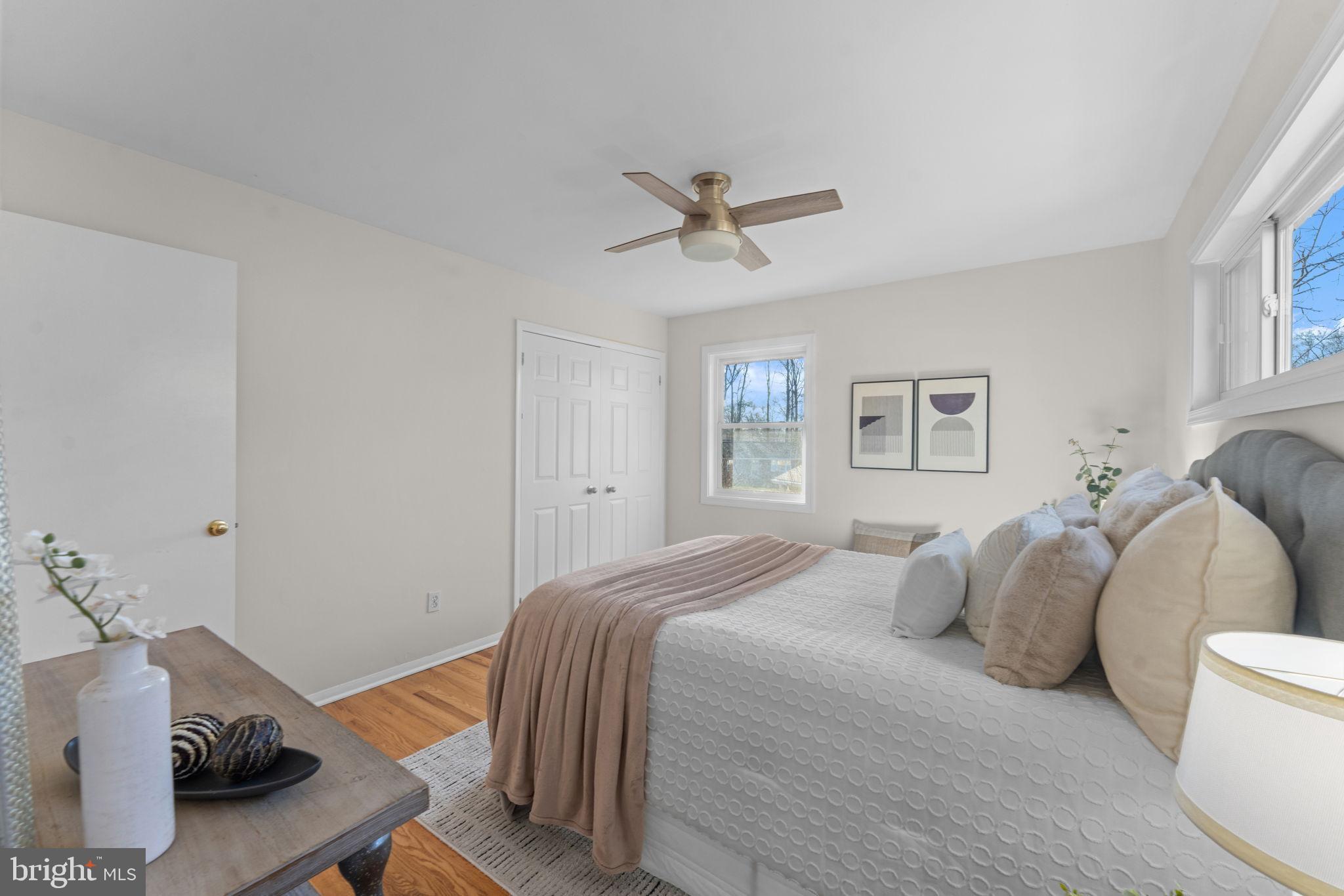 7448 Long Pine Drive Springfield, VA 22151 - Photo 16 of 40 a bedroom with a bed and wooden floor