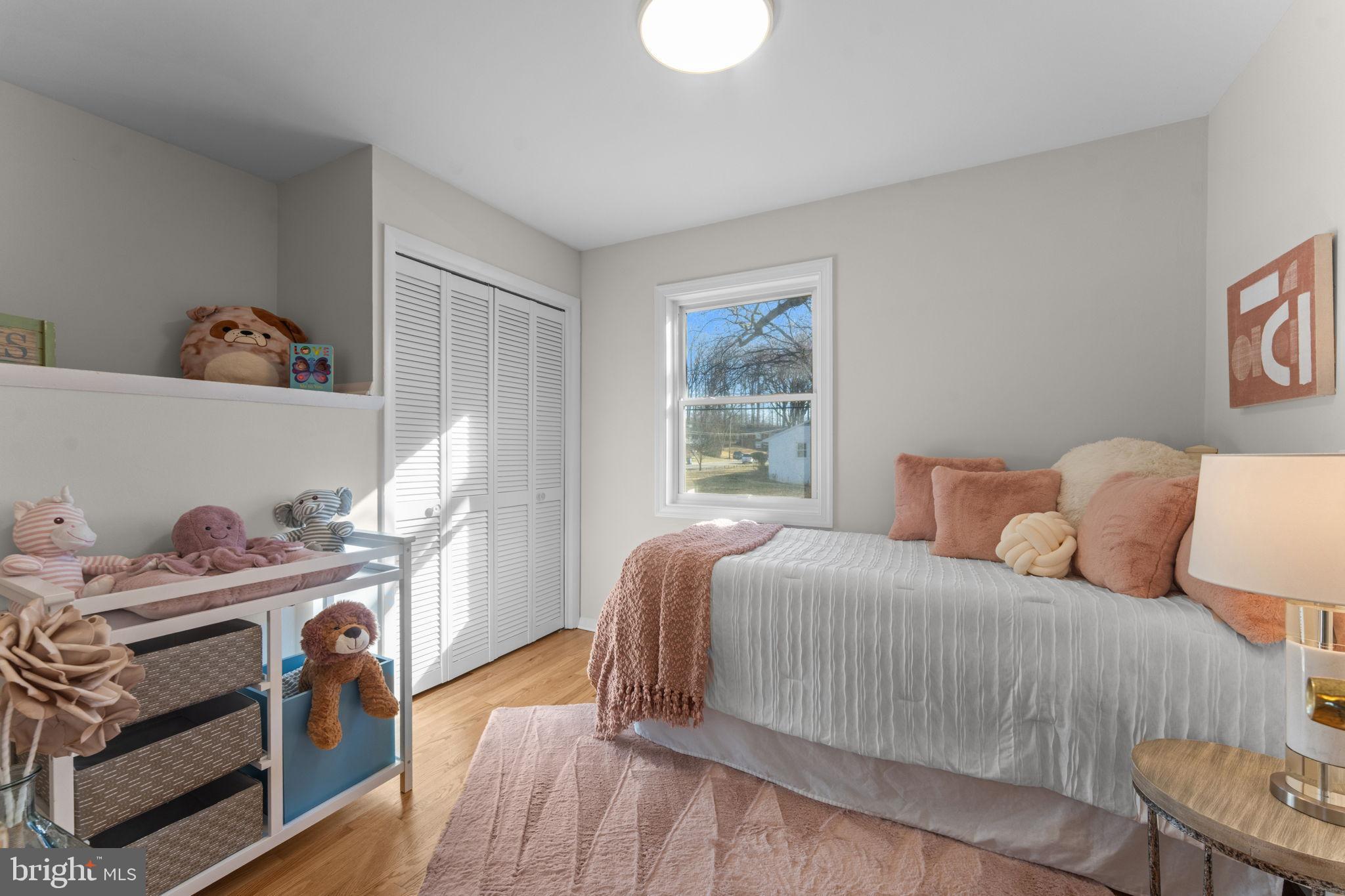 7448 Long Pine Drive Springfield, VA 22151 - Photo 19 of 40 a bedroom with a bed and a window