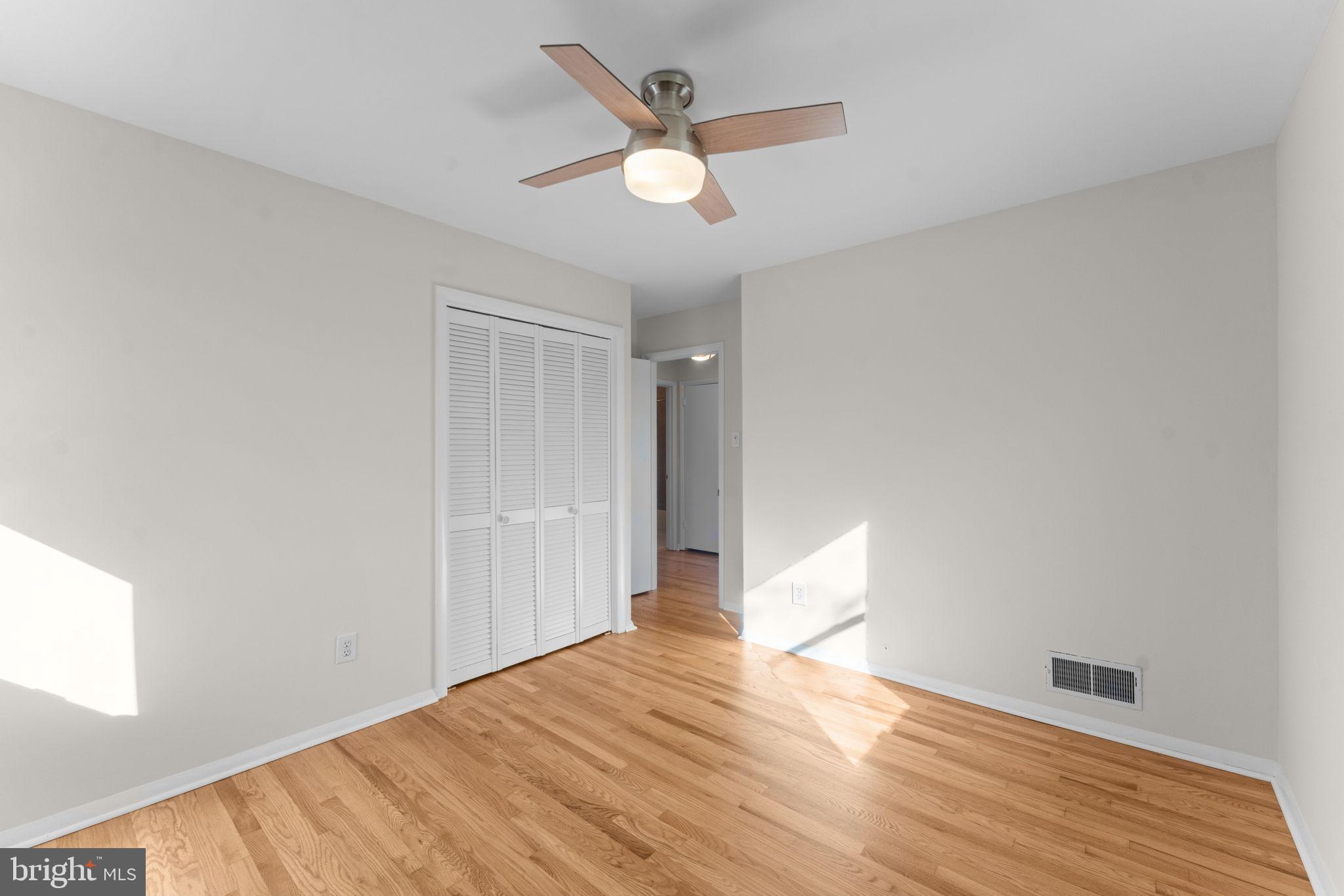 7448 Long Pine Drive Springfield, VA 22151 - Photo 22 of 40 a view of an empty room and wooden floor