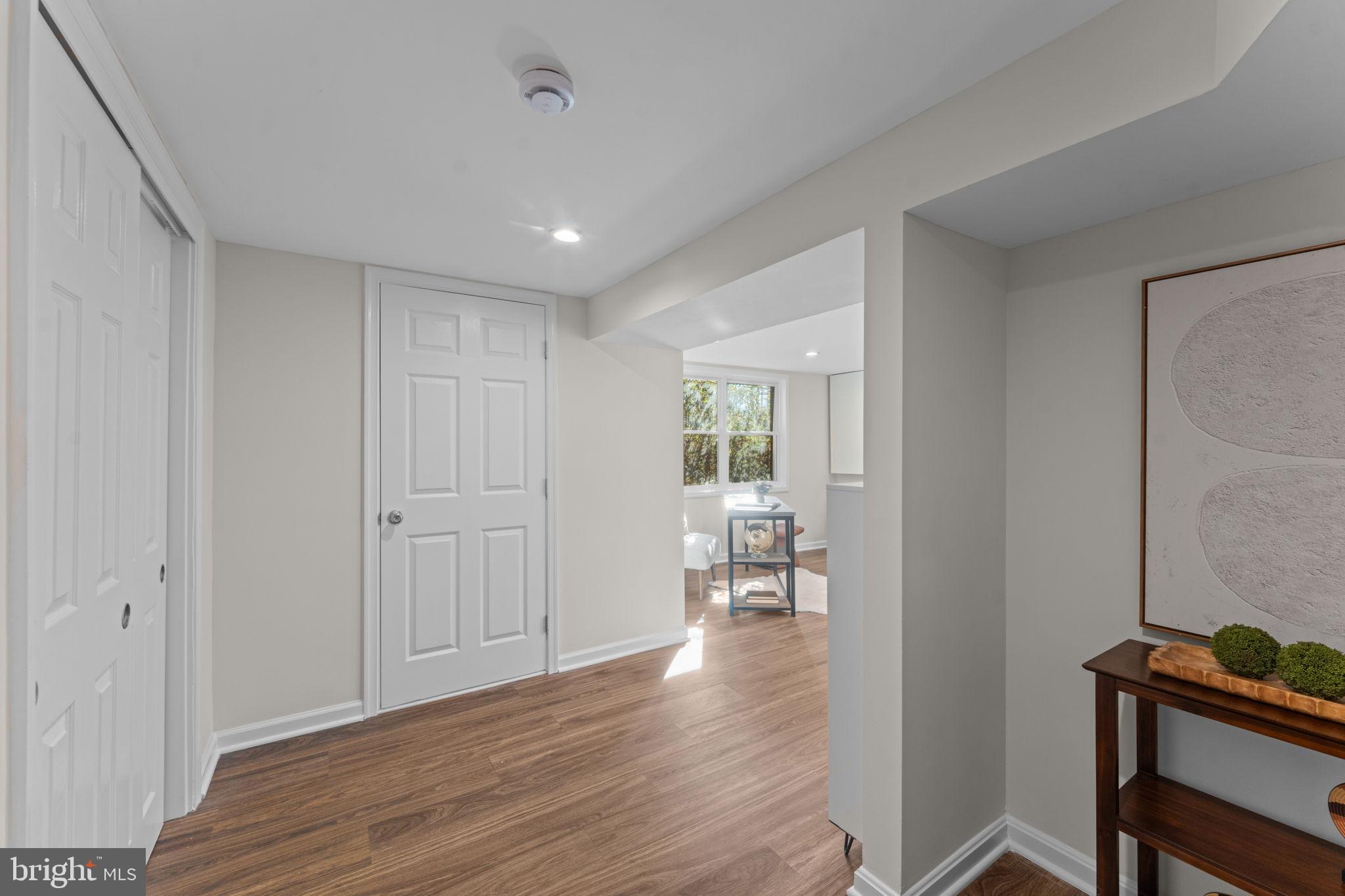 7448 Long Pine Drive Springfield, VA 22151 - Photo 26 of 40 a view of a room with wooden floor and a bathroom