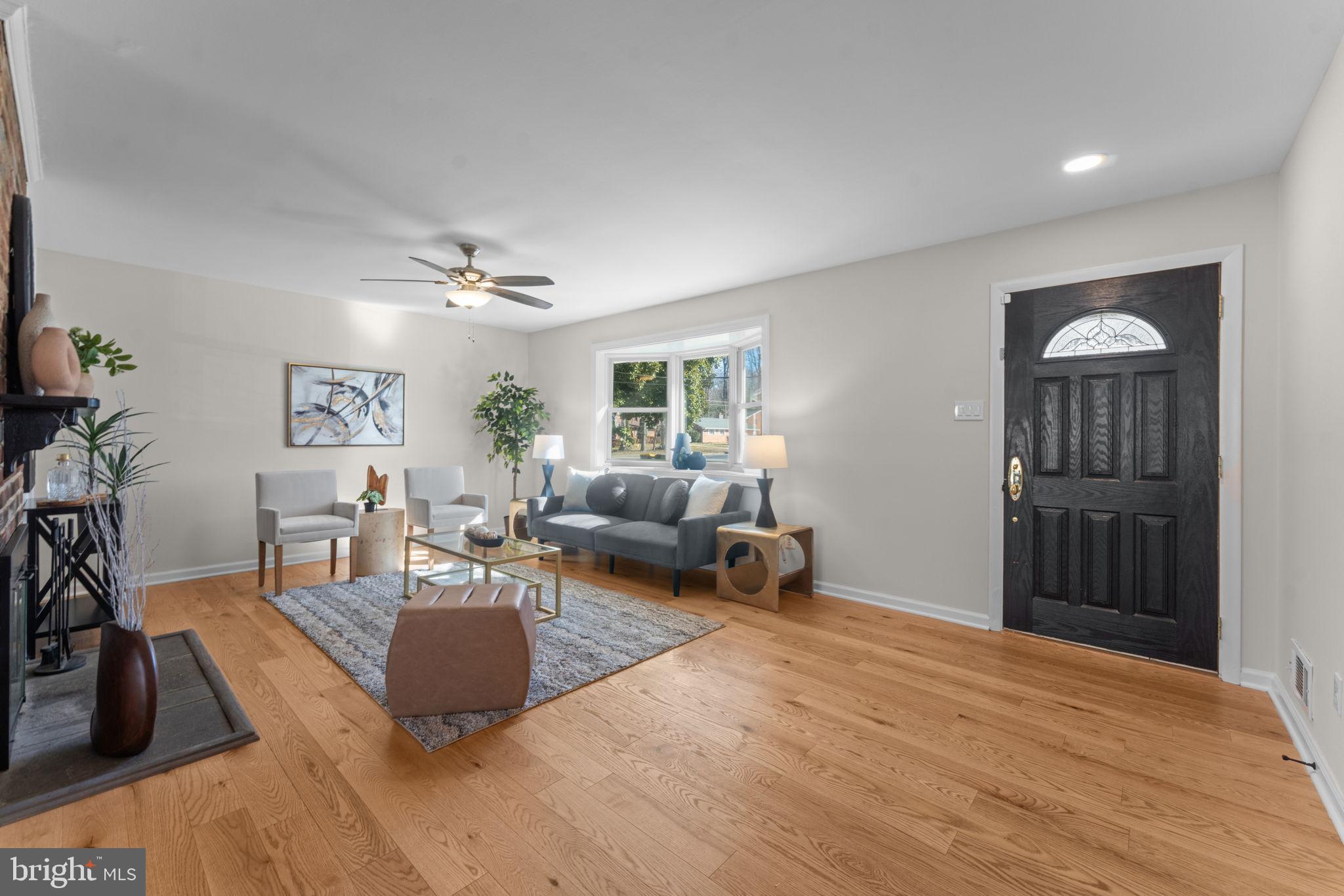 7448 Long Pine Drive Springfield, VA 22151 - Photo 5 of 40 a living room with furniture window and wooden floor