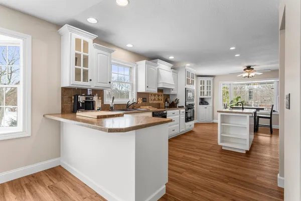 a kitchen with counter top space cabinets and appliances