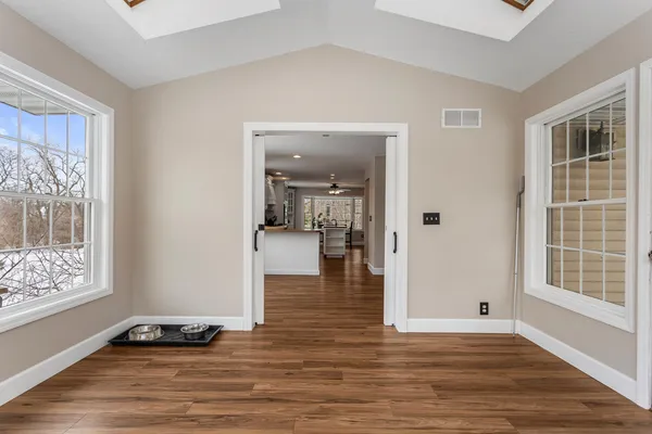 a view of a living room and a wooden floor