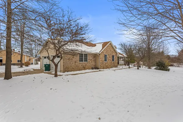 a view of a house with a snow in front of house