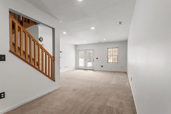 a view of a hallway with staircase