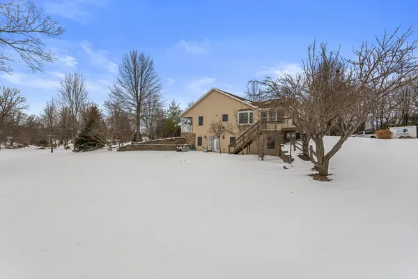 a view of a house with a snow in the yard