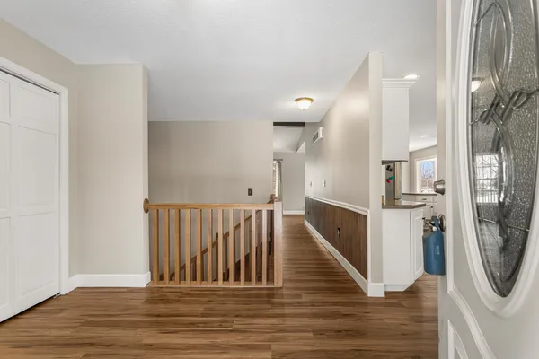 a view of entryway with wooden floor