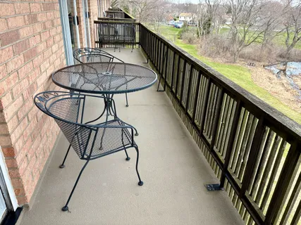 a view of a balcony with furniture