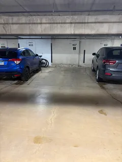 a view of parking garage with cars