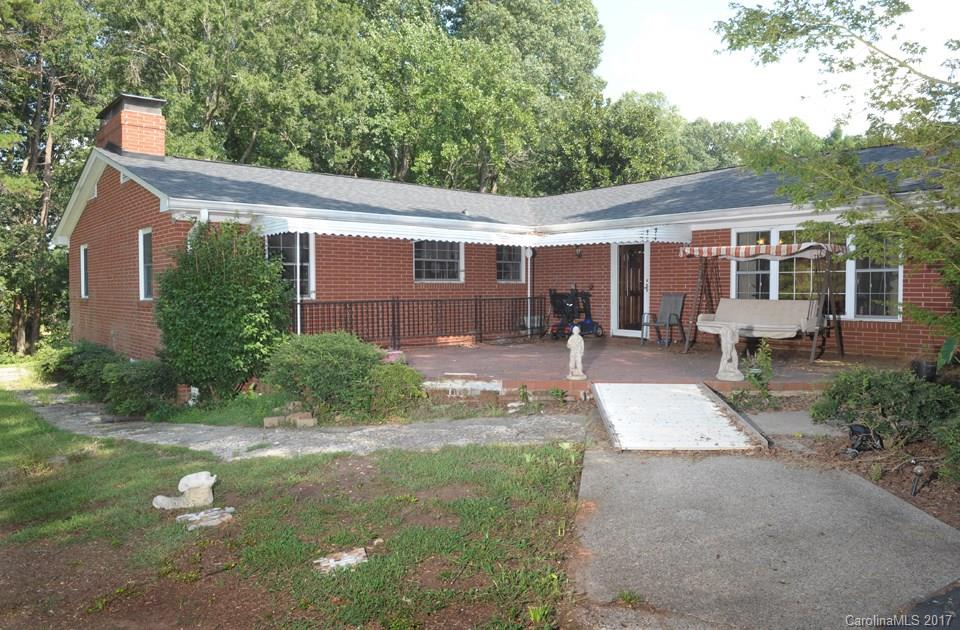 7135 Pop Basinger Road Salisbury, NC 28146 - Photo 2 of 23 a front view of a house with yard and green space
