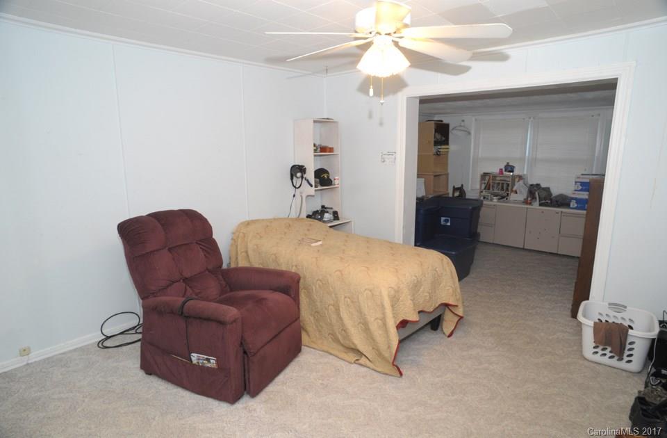 7135 Pop Basinger Road Salisbury, NC 28146 - Photo 16 of 23 a bed room with a bed and a chair
