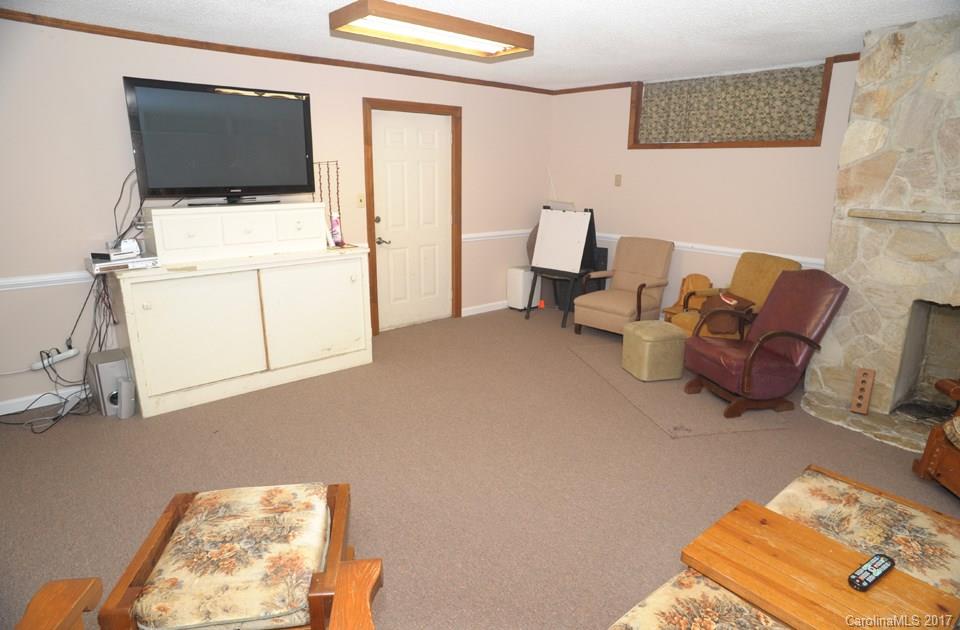 7135 Pop Basinger Road Salisbury, NC 28146 - Photo 19 of 23 a living room with furniture and a flat screen tv