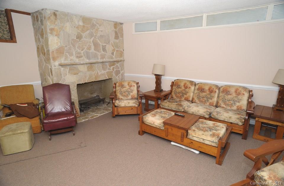 7135 Pop Basinger Road Salisbury, NC 28146 - Photo 20 of 23 a living room with furniture and a fireplace