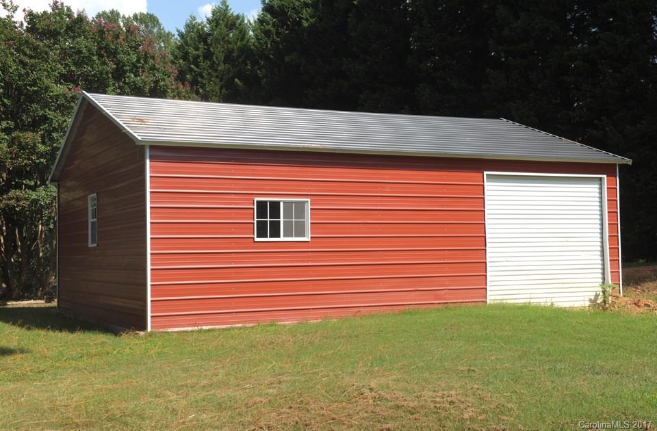 7135 Pop Basinger Road Salisbury, NC 28146 - Photo 23 of 23 a front view of a house with a garden