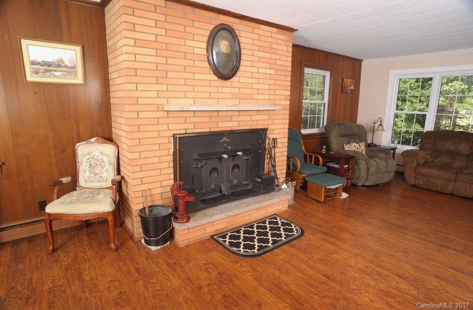 7135 Pop Basinger Road Salisbury, NC 28146 - Photo 5 of 23 a living room with furniture and a fireplace