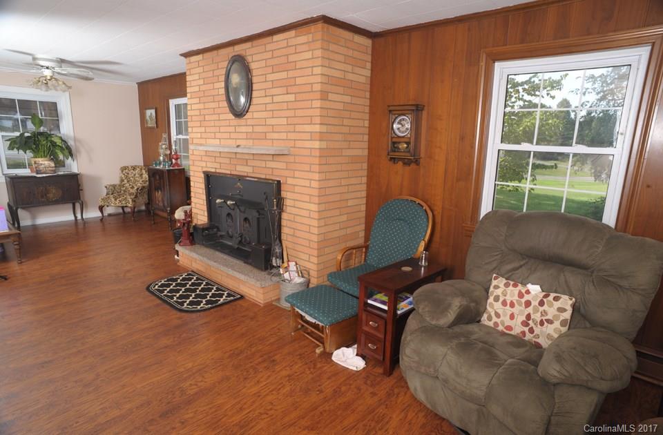 7135 Pop Basinger Road Salisbury, NC 28146 - Photo 6 of 23 a living room with furniture and a fireplace