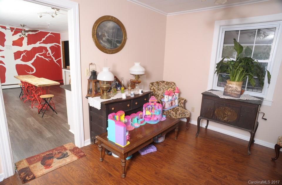 7135 Pop Basinger Road Salisbury, NC 28146 - Photo 7 of 23 a living room with furniture and a wooden floor