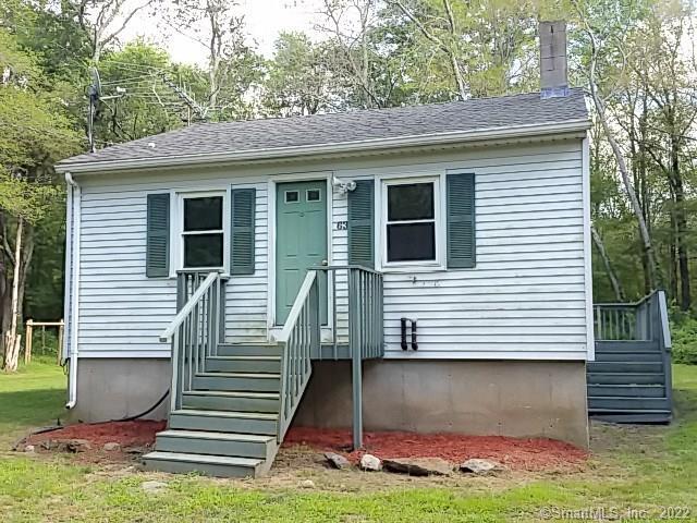 63 Oliver Road Lebanon, CT 06249 - Photo 1 of 1 a front view of a house with a yard