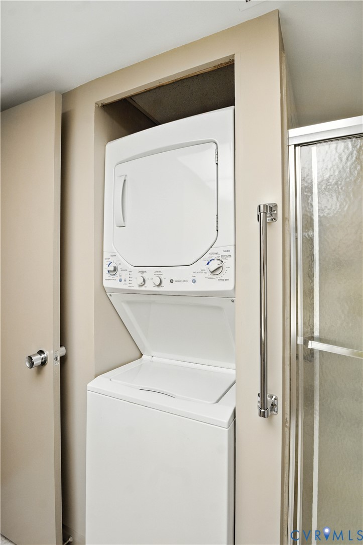2956 Hathaway Road, Unit U102 Richmond, VA 23225 - Photo 19 of 37 Laundry area featuring stacked washer and clothes