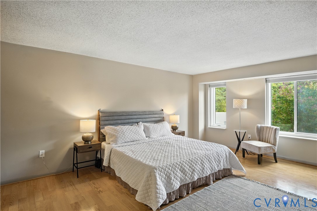 2956 Hathaway Road, Unit U102 Richmond, VA 23225 - Photo 20 of 37 Bedroom featuring light wood-type flooring and a t