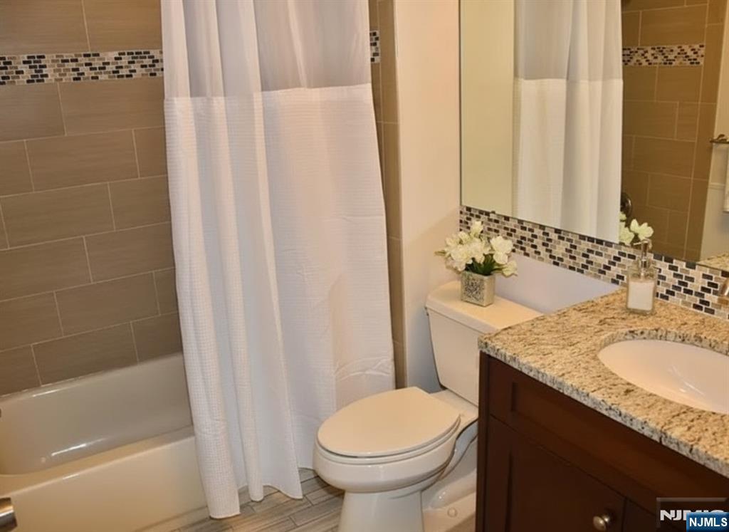 727 Pepperidge Road Mahwah, NJ 07430 - Photo 10 of 10 a bathroom with a granite countertop sink toilet and shower