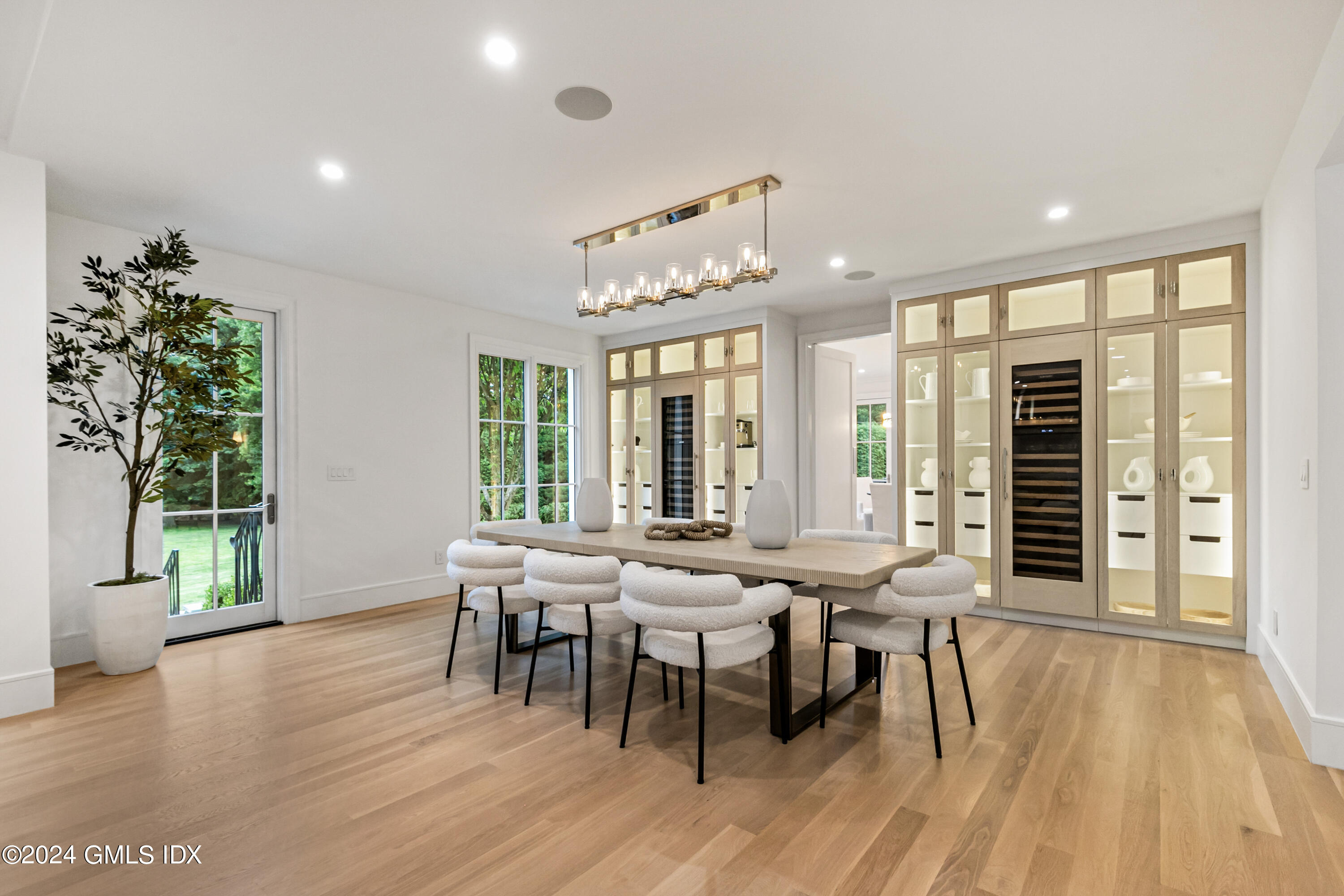 248 Round Hill Road Greenwich, CT 06831 - Photo 13 of 49 a view of a dining room with furniture and wooden floor
