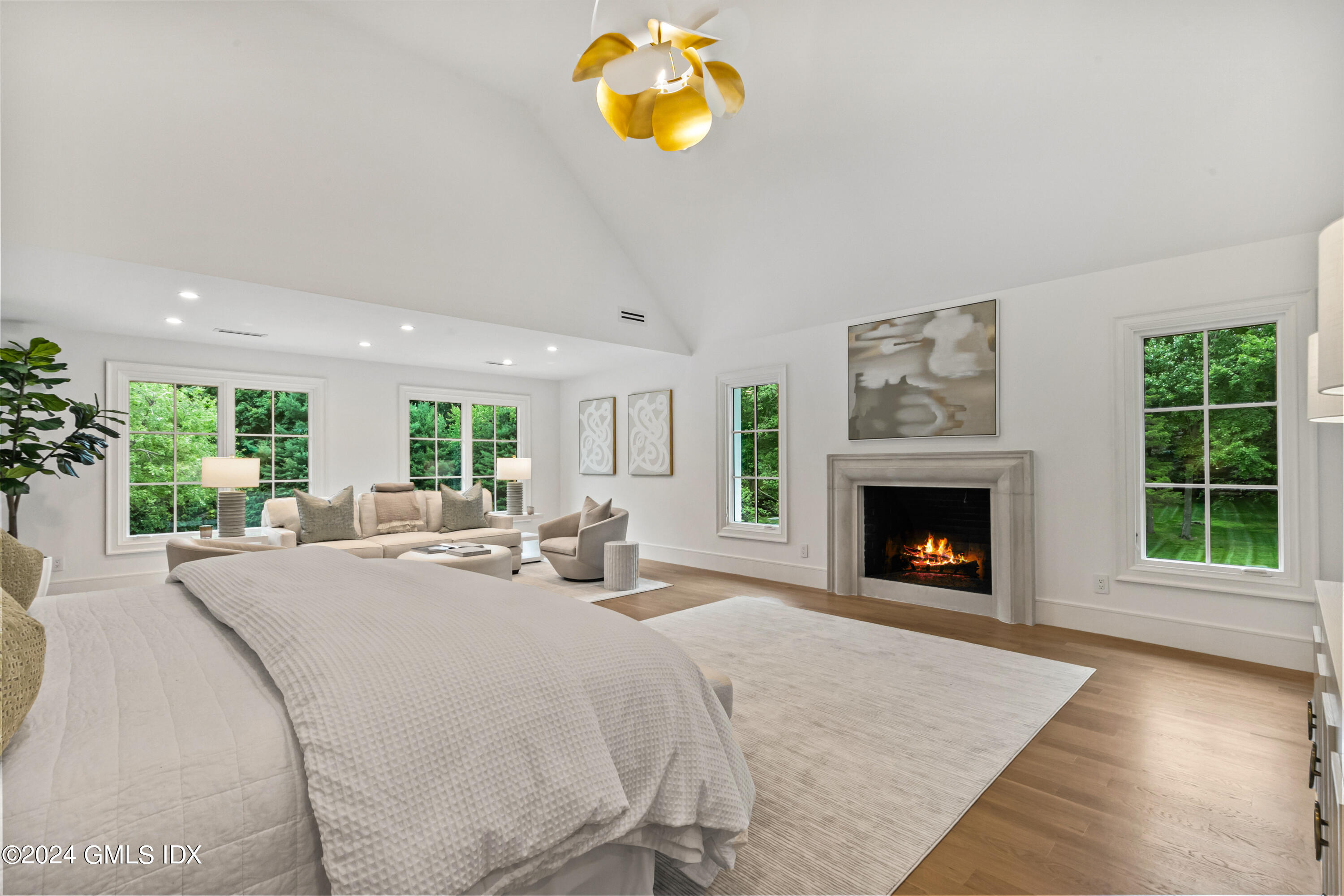 248 Round Hill Road Greenwich, CT 06831 - Photo 20 of 49 a bed room with a bed and a fireplace
