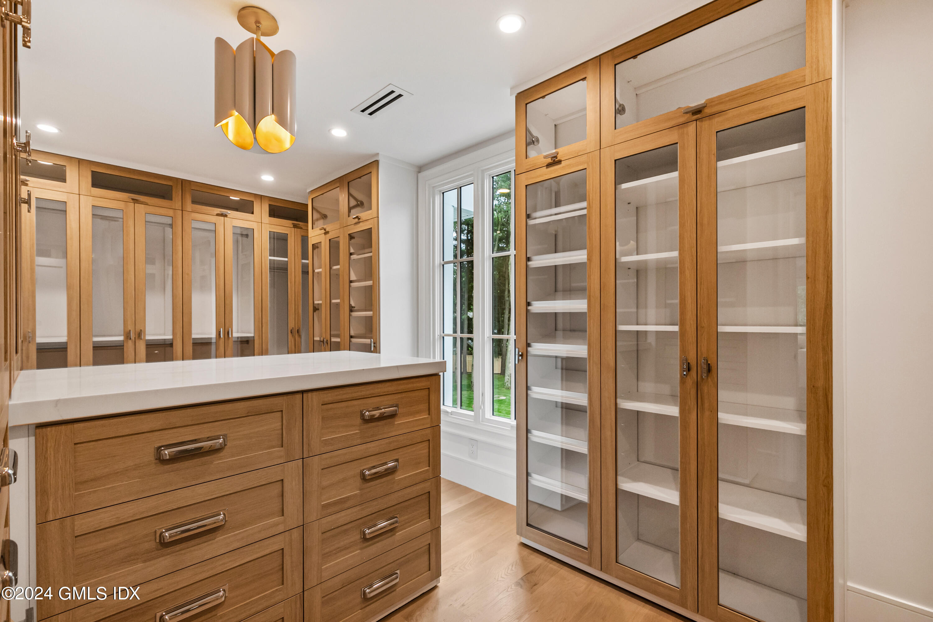 248 Round Hill Road Greenwich, CT 06831 - Photo 26 of 49 a bathroom with a shower sink and mirror