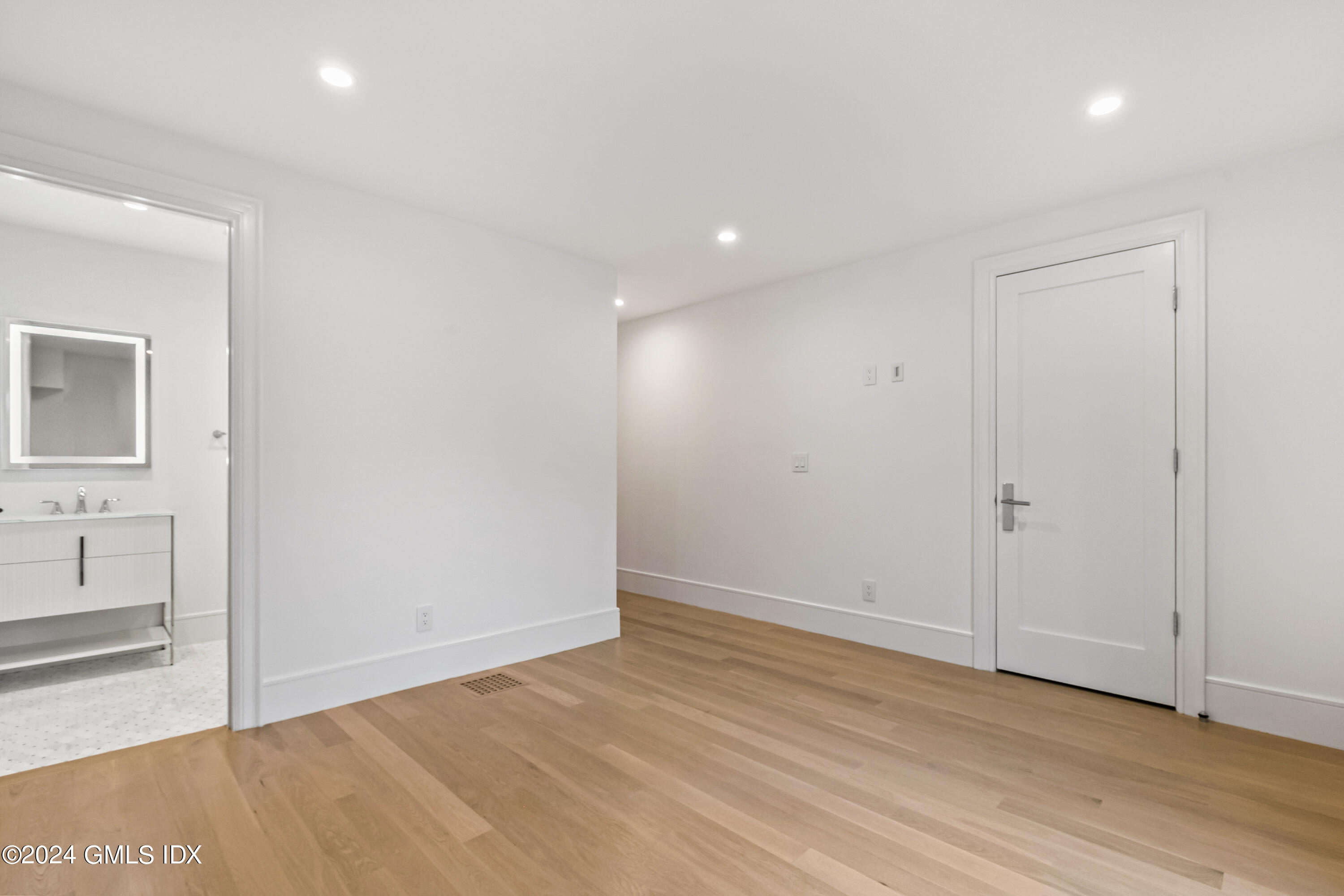 248 Round Hill Road Greenwich, CT 06831 - Photo 28 of 49 wooden floor in an empty room with a window