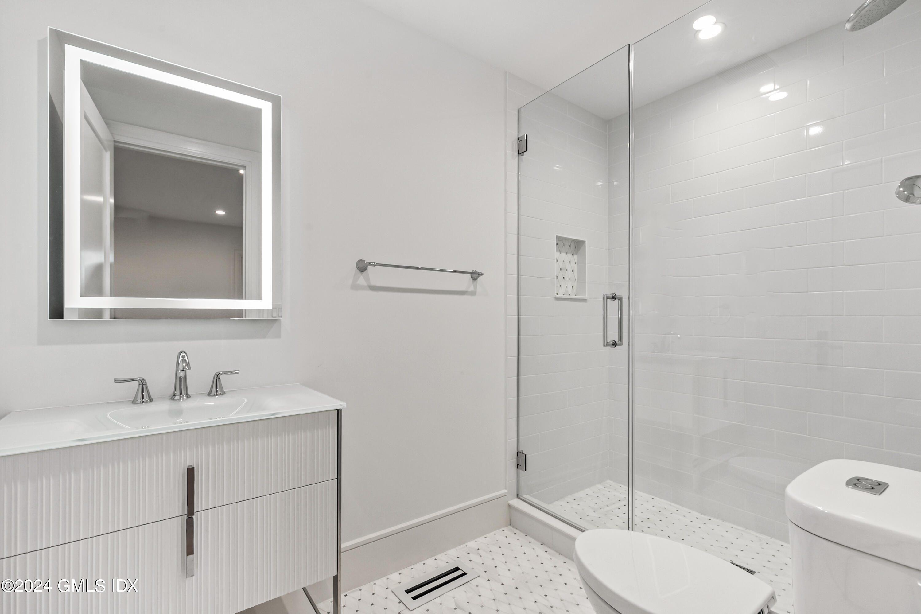 248 Round Hill Road Greenwich, CT 06831 - Photo 29 of 49 a bathroom with a toilet a sink and shower