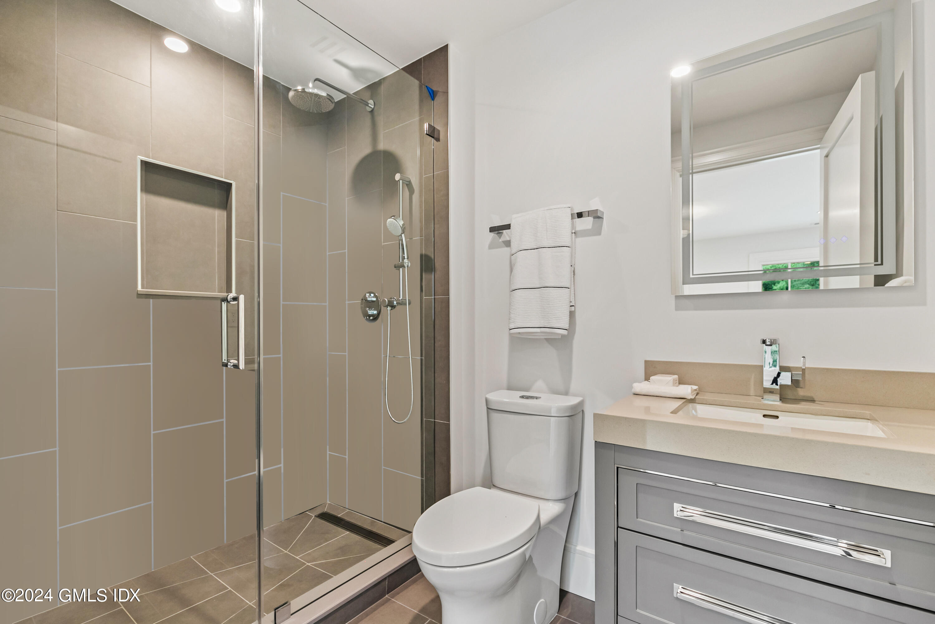 248 Round Hill Road Greenwich, CT 06831 - Photo 30 of 49 a bathroom with a sink a toilet and shower