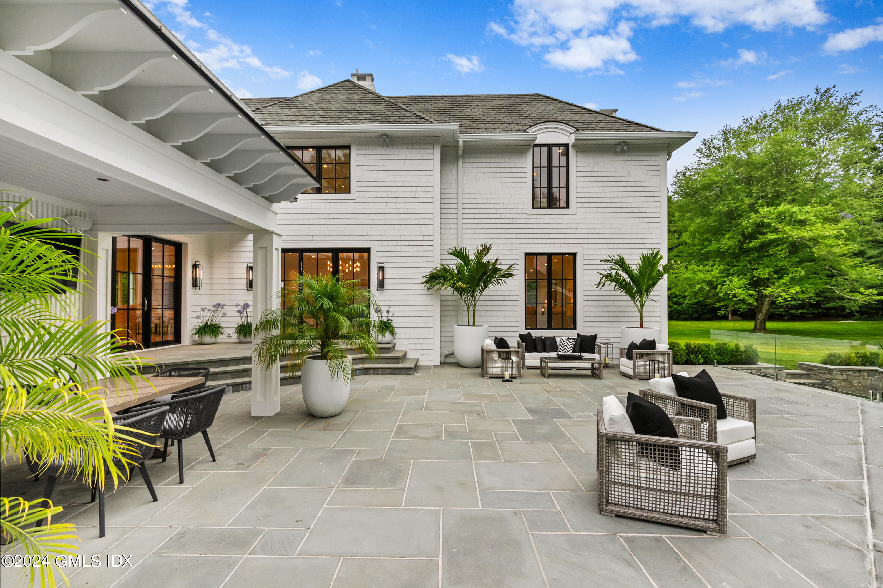 248 Round Hill Road Greenwich, CT 06831 - Photo 39 of 49 a view of a patio with couches and potted plants