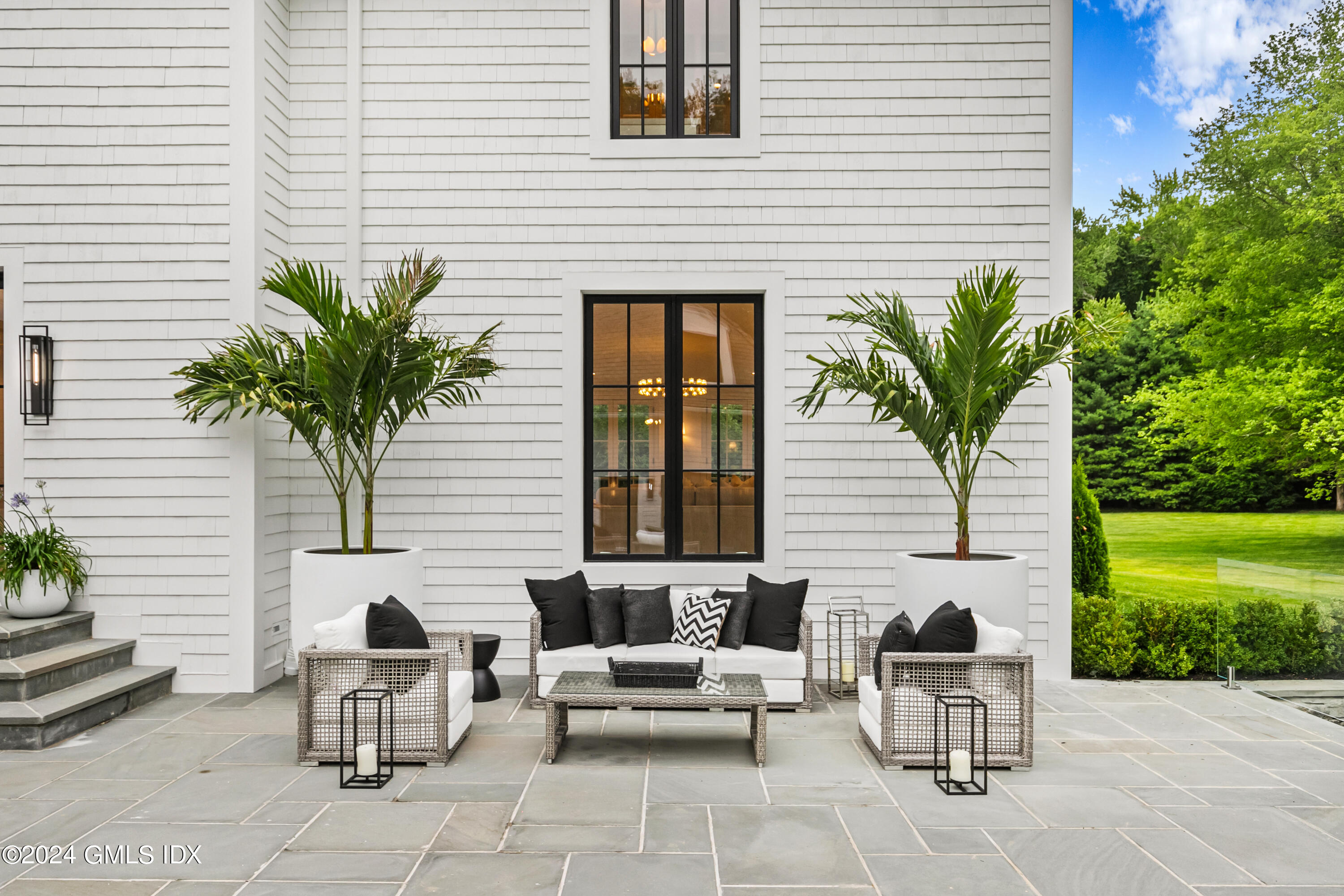 248 Round Hill Road Greenwich, CT 06831 - Photo 40 of 49 a view of a patio with couple of chairs and potted plants