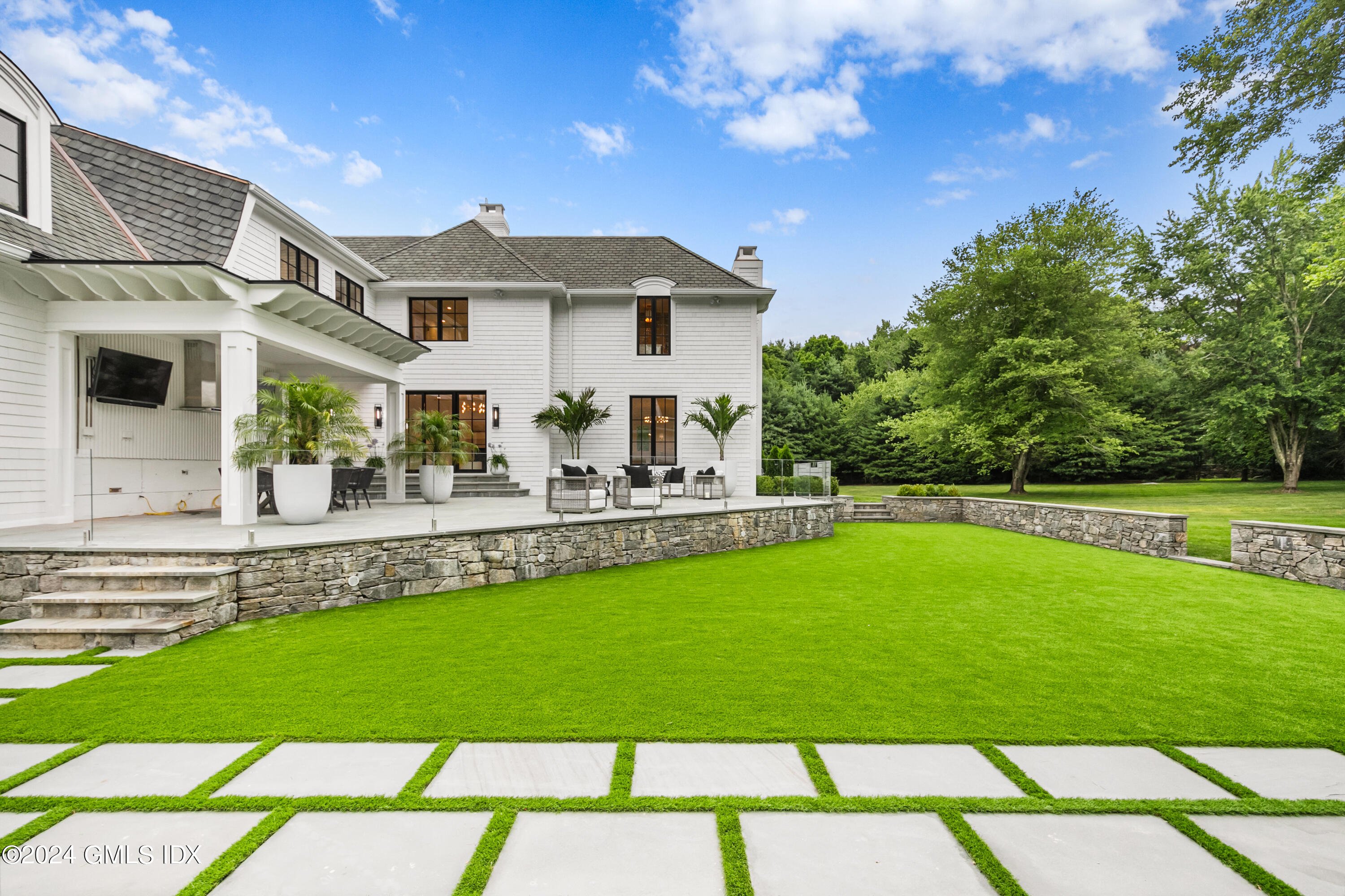 248 Round Hill Road Greenwich, CT 06831 - Photo 41 of 49 a view of a house with a backyard patio and swimming pool
