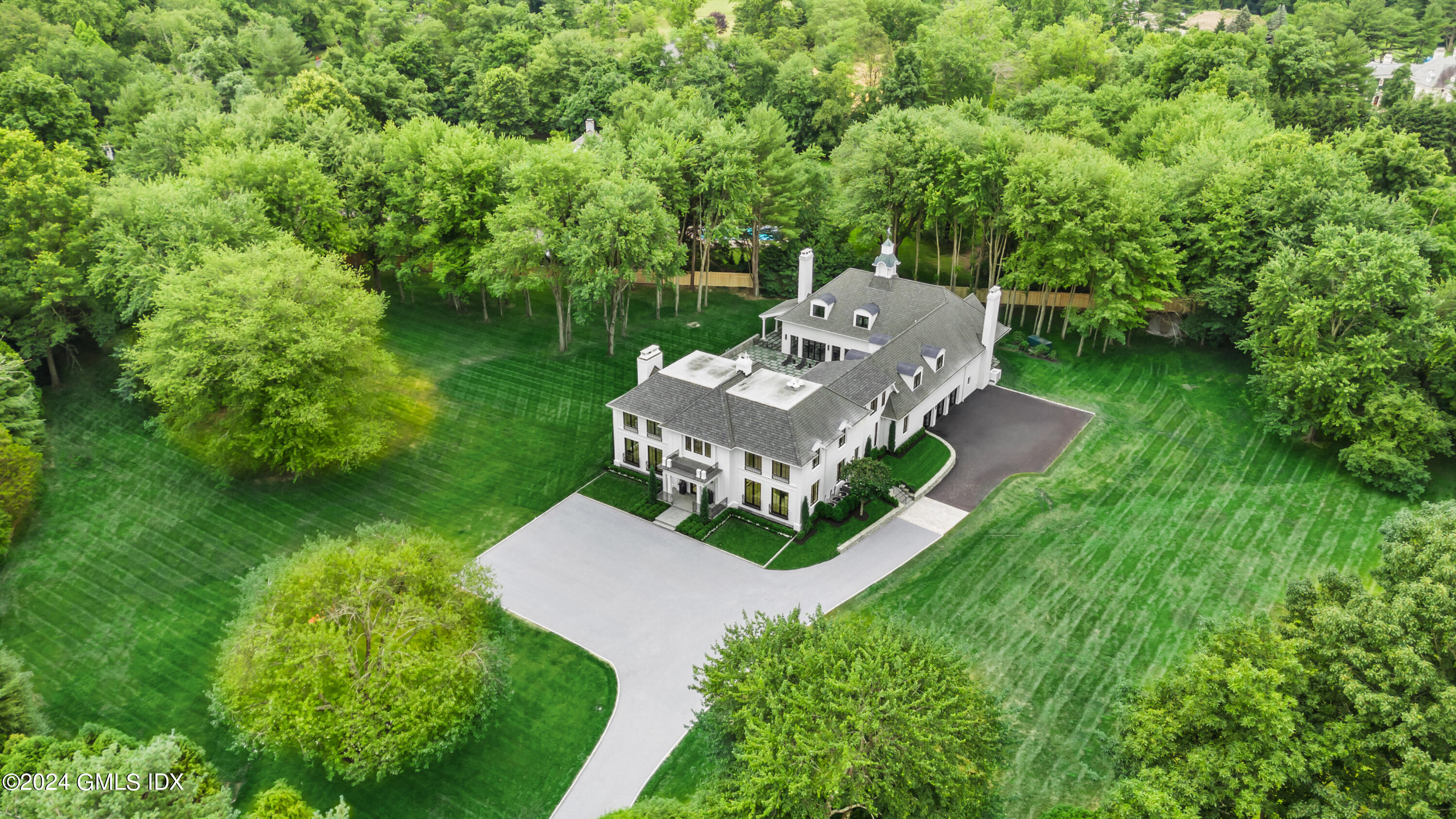 248 Round Hill Road Greenwich, CT 06831 - Photo 44 of 49 a view of a garden with lawn chairs