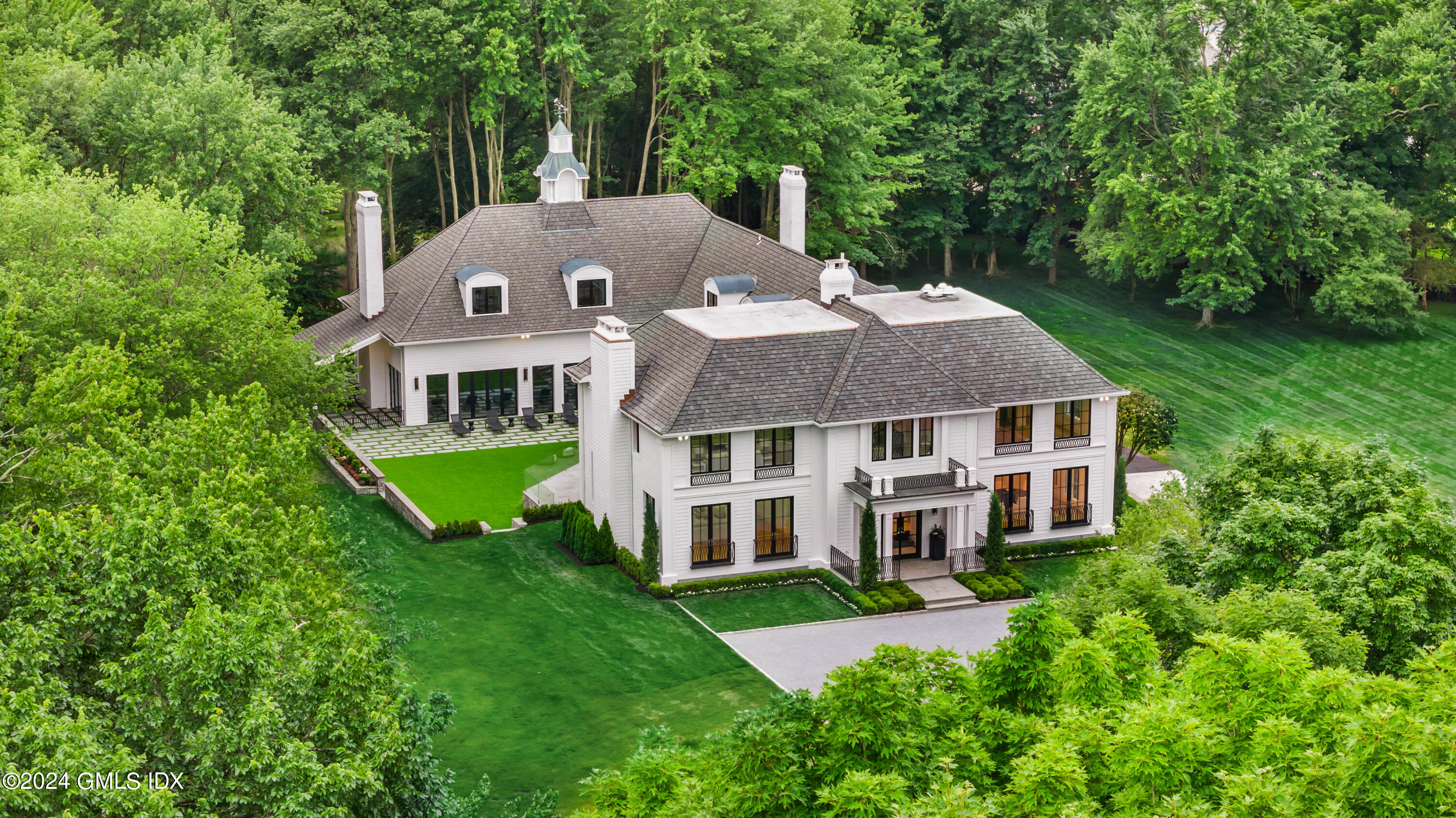 248 Round Hill Road Greenwich, CT 06831 - Photo 45 of 49 front view of a house with a big yard