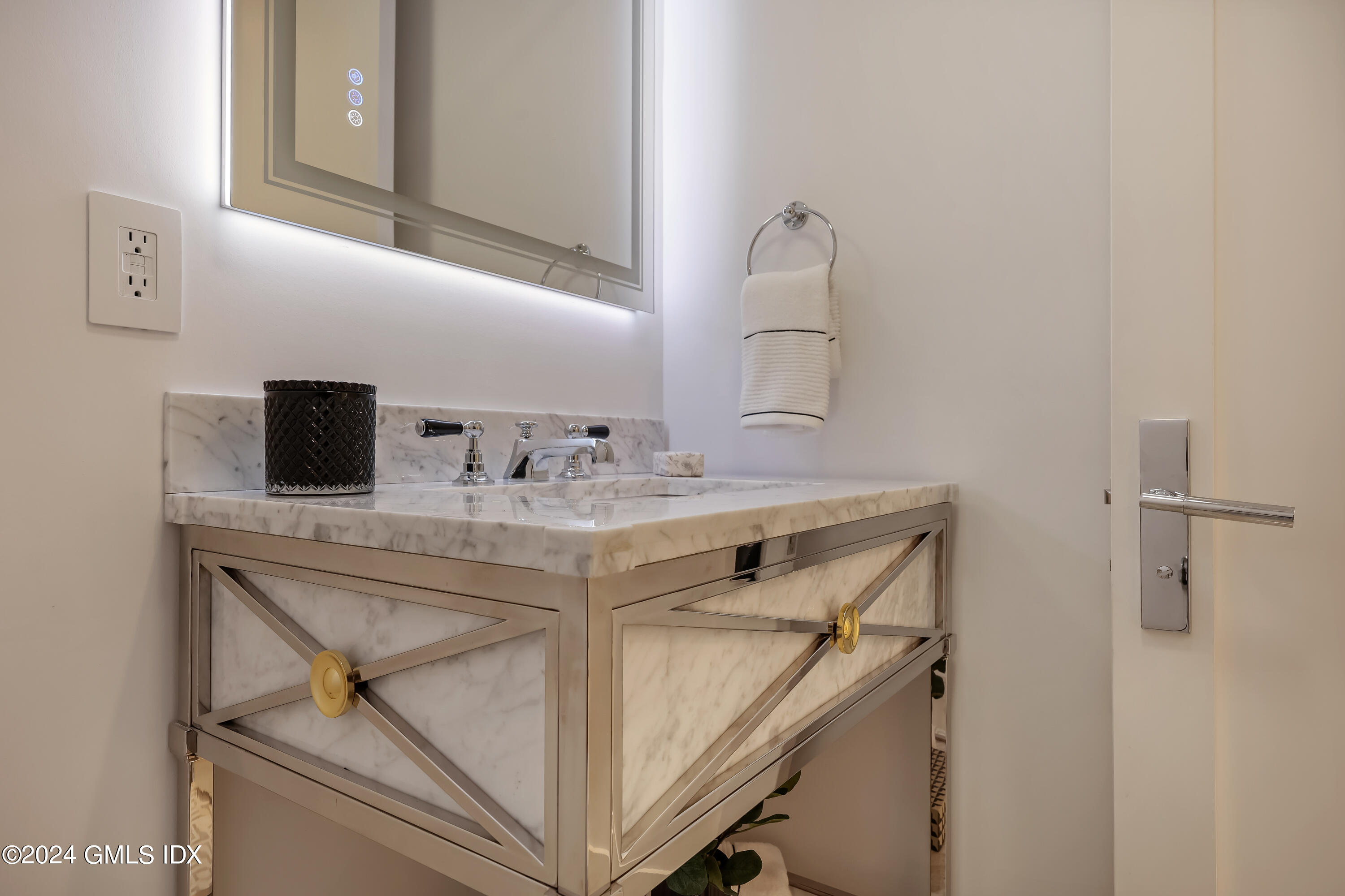 248 Round Hill Road Greenwich, CT 06831 - Photo 8 of 49 a bathroom with a sink and a mirror