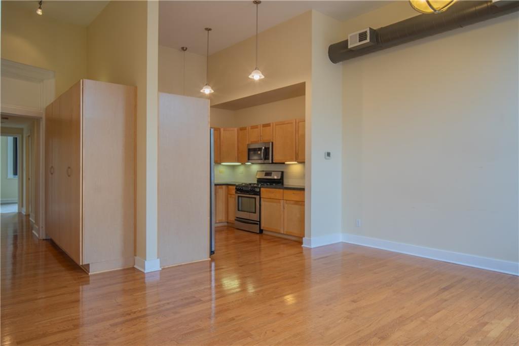 10 Walnut Street, Unit 6 Pittsburgh, PA 15202 - Photo 11 of 35 a view of kitchen view with wooden floor and cabinets