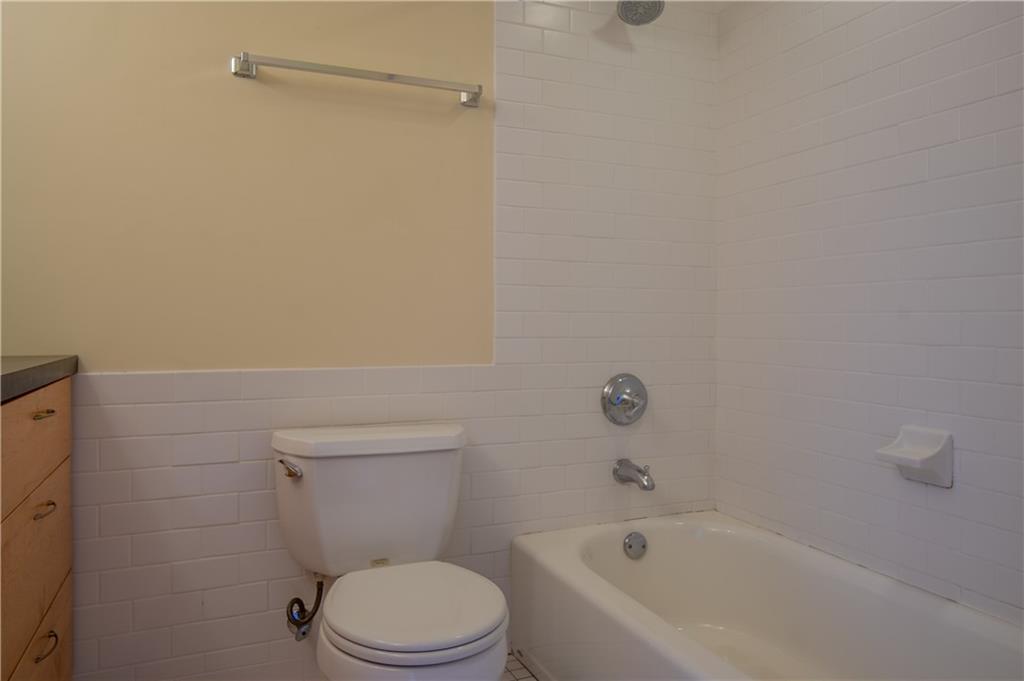 10 Walnut Street, Unit 6 Pittsburgh, PA 15202 - Photo 26 of 35 a white toilet sitting next to a bath tub