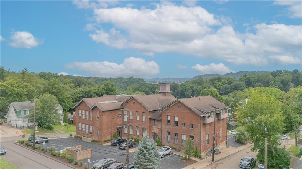 10 Walnut Street, Unit 6 Pittsburgh, PA 15202 - Photo 3 of 35 a view of a house with a yard and wooden fence