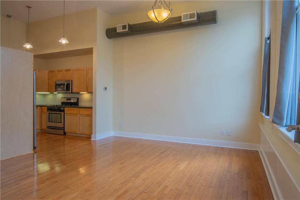 10 Walnut Street, Unit 6 Pittsburgh, PA 15202 - Photo 10 of 35 a kitchen with a refrigerator and a stove top oven