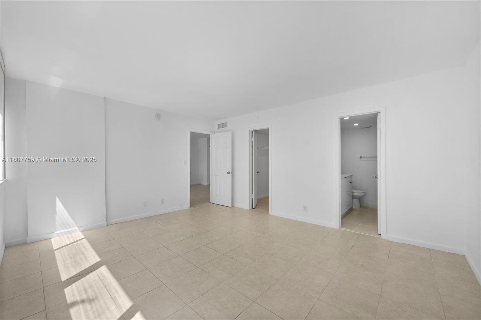 4222 Inverrary Boulevard, Unit 4211 Lauderhill, FL 33319 - Photo 8 of 17 a view of an empty room with a window