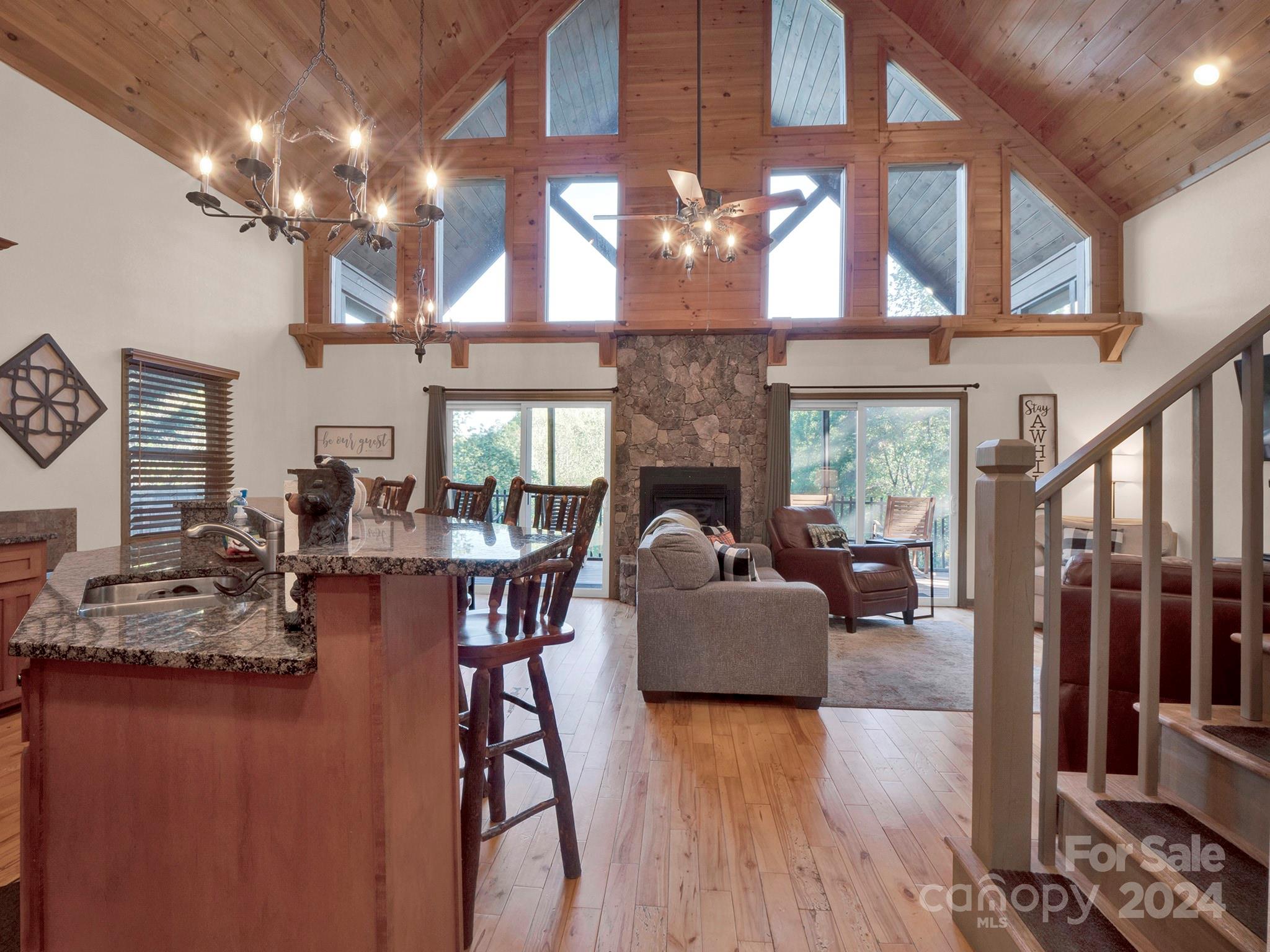 195 Grandview Mesa Road Whittier, NC 28789 - Photo 12 of 37 a living room with fireplace furniture and a large window